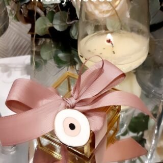 Χρυσή μεταλλική μπιζουτιέρα γυάλινη με διακοσμητικό κόσμημα μάτι απο σμάλτο